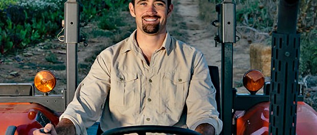 Lawrence on tractor Veteran Farmers of America